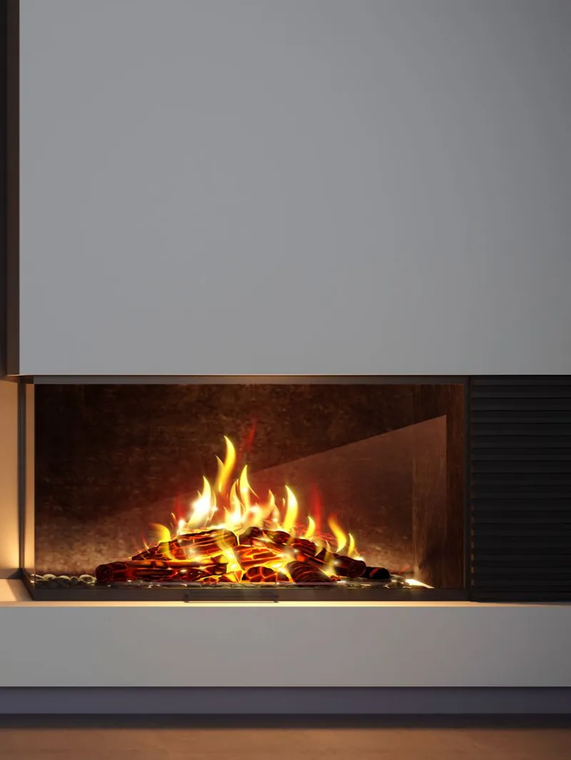 Une cheminée moderne avec des flammes brûlant derrière une vitre.